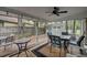 Covered and screened patio area with outdoor furniture and decor providing a relaxing outdoor retreat at 109 Willow Ct, Summerville, SC 29486