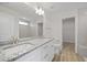 Bathroom featuring double sinks, granite countertops, and a tiled walk-in shower at 112 Shingle Oak Dr, Moncks Corner, SC 29461