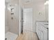 Bathroom featuring tiled walk-in shower, vanity with granite countertops, and tile floors at 112 Shingle Oak Dr, Moncks Corner, SC 29461