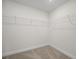 Walk-in closet with carpeted floors and plenty of storage space with wire shelving at 112 Shingle Oak Dr, Moncks Corner, SC 29461