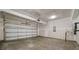 Spacious unfinished garage with concrete floor, and an insulated garage door at 112 Shingle Oak Dr, Moncks Corner, SC 29461