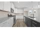 Modern kitchen featuring white cabinets, stainless steel appliances, and granite countertops at 112 Shingle Oak Dr, Moncks Corner, SC 29461