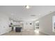 Bright living room features hardwood floors, kitchen island, sliding doors, and natural light at 112 Shingle Oak Dr, Moncks Corner, SC 29461