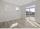 Bright living room features hardwood floors, sliding doors, and natural light at 112 Shingle Oak Dr, Moncks Corner, SC 29461
