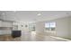 Bright living room features hardwood floors, kitchen island, sliding doors, and natural light at 112 Shingle Oak Dr, Moncks Corner, SC 29461
