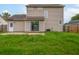 Back exterior of home featuring sliding glass door, and large backyard with lush green grass at 113 Alcester Rd, Goose Creek, SC 29445