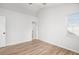 Bright bedroom featuring light-colored walls, wood floors and a window with blinds, and closet at 113 Alcester Rd, Goose Creek, SC 29445