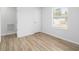 Bright bedroom featuring light-colored walls, wood floors, a window with blinds, and a closet at 113 Alcester Rd, Goose Creek, SC 29445