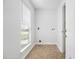 Bright laundry room with a window, utility connections and durable flooring at 113 Alcester Rd, Goose Creek, SC 29445