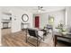 Inviting living room open to kitchen with wood floors, ceiling fan, and contemporary furniture at 113 Alcester Rd, Goose Creek, SC 29445
