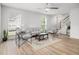 Bright living room with modern furnishings, hardwood floors, a ceiling fan, and lots of natural light at 113 Alcester Rd, Goose Creek, SC 29445