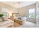 Bedroom with desk, neutral walls, and natural light from two windows at 1148 Black Rush Cir, Mount Pleasant, SC 29466