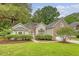 Charming home featuring a manicured lawn, lush landscaping, and a blend of brick and siding on the exterior at 1148 Black Rush Cir, Mount Pleasant, SC 29466