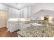 Bright kitchen featuring granite countertops, white cabinets, and modern appliances at 1148 Black Rush Cir, Mount Pleasant, SC 29466