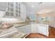 Well-lit kitchen featuring updated appliances, granite countertops, and white cabinets at 1148 Black Rush Cir, Mount Pleasant, SC 29466