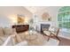 Inviting living room with a cozy fireplace, stylish decor, and comfortable seating at 1148 Black Rush Cir, Mount Pleasant, SC 29466