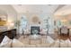 Comfortable living room featuring neutral tones, a fireplace, and a seamless flow into the dining area at 1148 Black Rush Cir, Mount Pleasant, SC 29466