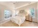 Bright main bedroom showcasing an adjacent sitting room with large windows at 1148 Black Rush Cir, Mount Pleasant, SC 29466