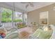 Inviting covered porch features wicker seating and swing, creating a relaxing outdoor space at 1148 Black Rush Cir, Mount Pleasant, SC 29466