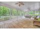 Spacious porch with wicker furniture and wooden floors, perfect for enjoying the surrounding nature at 1148 Black Rush Cir, Mount Pleasant, SC 29466