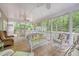 Charming porch with wicker furniture offering ample seating and views of the lush backyard at 1148 Black Rush Cir, Mount Pleasant, SC 29466