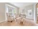 Sitting room with wingback chairs, large windows and neutral decor at 1148 Black Rush Cir, Mount Pleasant, SC 29466