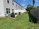 Exterior view of the house with a grassy backyard and white privacy fence at 116 Gaura Ln, Summerville, SC 29483