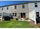 Backyard view featuring a sliding glass door, lawn, fence and rocking chairs at 116 Gaura Ln, Summerville, SC 29483