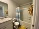 Full bathroom featuring tub and shower combination, toilet, vanity sink, and a yellow rug at 116 Gaura Ln, Summerville, SC 29483