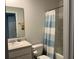 Neat bathroom featuring a vanity, toilet and a shower with striped curtain, providing functionality and comfort at 116 Gaura Ln, Summerville, SC 29483