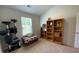 Bright bedroom with bookshelves, cat tree, bench seat, and natural light from a window at 116 Gaura Ln, Summerville, SC 29483