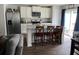 Stylish kitchen with stainless steel appliances, island with seating, and a sliding door to the backyard at 116 Gaura Ln, Summerville, SC 29483
