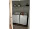Laundry closet with side-by-side white washing machine and dryer and wire shelving at 116 Gaura Ln, Summerville, SC 29483
