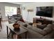 Cozy living room featuring comfortable seating, a large TV, and an adjacent dining area for entertaining at 116 Gaura Ln, Summerville, SC 29483