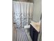 Well-maintained bathroom with dark blue vanity and coordinated shower curtain at 123 Lynches River Dr, Summerville, SC 29485