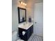 Compact bathroom boasts a navy vanity, offering a neat and functional space at 123 Lynches River Dr, Summerville, SC 29485