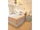 Comfortable bedroom with a ceiling fan, warm lighting, and a cozy floral patterned comforter at 123 Lynches River Dr, Summerville, SC 29485