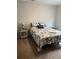 Comfortable bedroom featuring a floral patterned comforter, side tables and warm lighting at 123 Lynches River Dr, Summerville, SC 29485