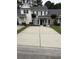 Charming townhome with neutral siding, black shutters, and a spacious concrete driveway at 123 Lynches River Dr, Summerville, SC 29485