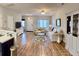 Open-concept living room featuring hardwood floors, neutral walls, and ample natural light at 123 Lynches River Dr, Summerville, SC 29485