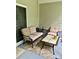 Inviting covered porch with comfortable seating, perfect for enjoying the outdoors at 123 Lynches River Dr, Summerville, SC 29485