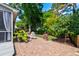 Landscaped backyard with brick patio and mature trees offering privacy at 1231 Wild Olive Dr, Mount Pleasant, SC 29464