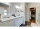 Bathroom with double vanity, granite counters, tile floor and walk in closet at 1231 Wild Olive Dr, Mount Pleasant, SC 29464