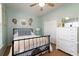 Bedroom with a ceiling fan, natural light, a black bed frame and white dresser at 1231 Wild Olive Dr, Mount Pleasant, SC 29464