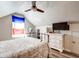 Bedroom featuring wood floors, black bed frame, white dresser, and French flag at 1231 Wild Olive Dr, Mount Pleasant, SC 29464