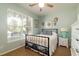 Bedroom with a ceiling fan, natural light, black bed frame and side table at 1231 Wild Olive Dr, Mount Pleasant, SC 29464