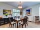 Dining room featuring hardwood floors, a wooden dining table, and decorative artwork at 1231 Wild Olive Dr, Mount Pleasant, SC 29464