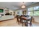 Bright dining area with hardwood floors, natural light, and an open layout connected to the living room at 1231 Wild Olive Dr, Mount Pleasant, SC 29464
