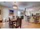 Open-concept dining room with stylish chandelier, a wood table, and convenient access to the kitchen at 1231 Wild Olive Dr, Mount Pleasant, SC 29464