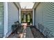 Inviting front entrance with double doors and a decorative hanging light fixture at 1231 Wild Olive Dr, Mount Pleasant, SC 29464